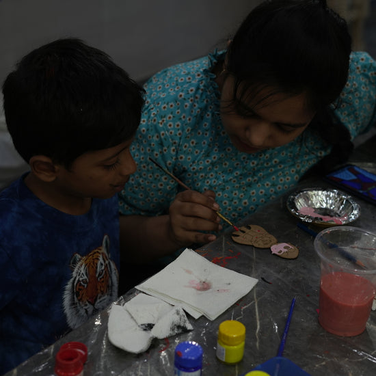 Two Kid making painting